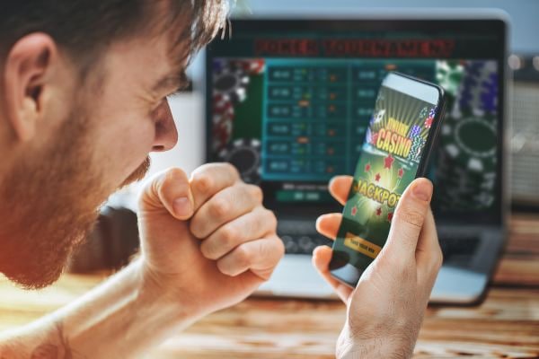 spinwin iOS Safari interface showing live dealer tables on iPhone portrait view